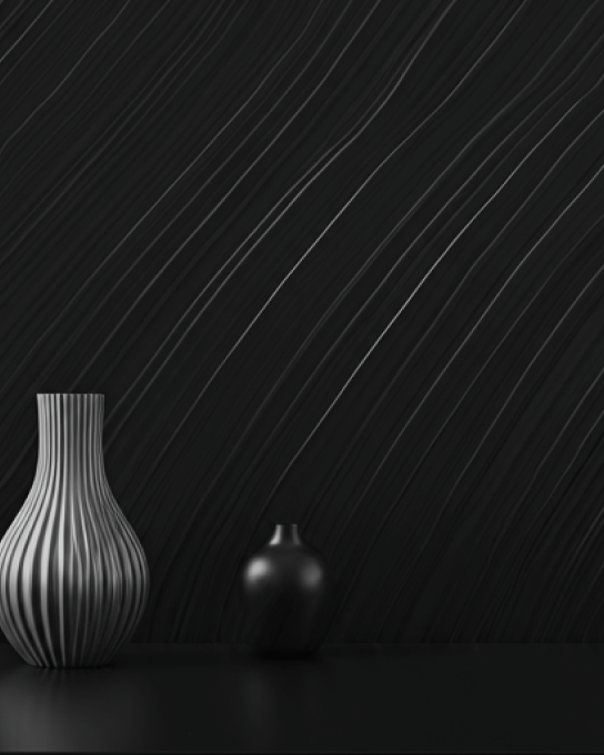 Two ceramic vessels on a dark ridged surface